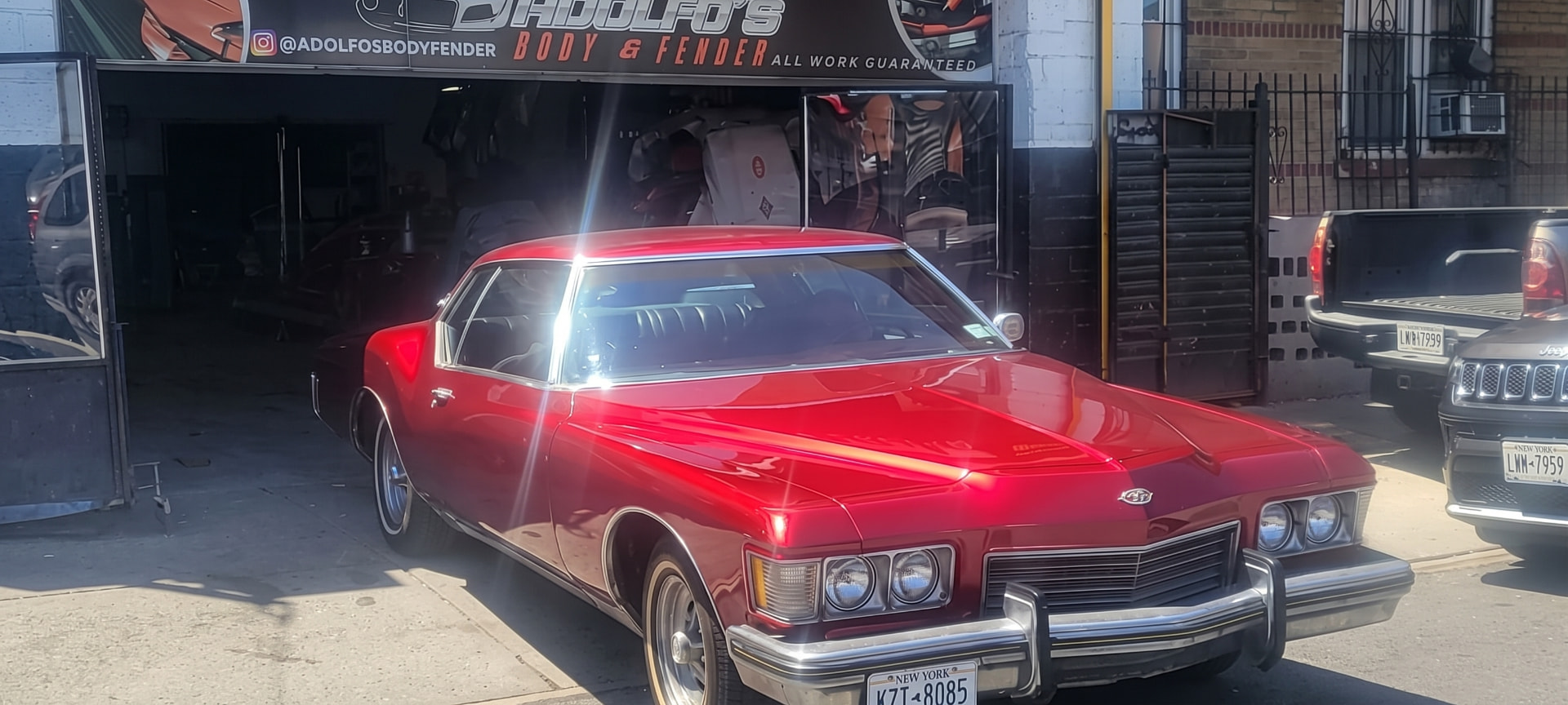 Red classic car showing a glossy completed paint finish