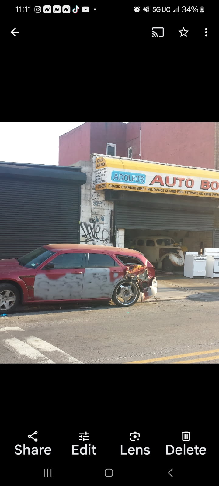 Vehicle with body filler preparation parked outside Adolfo's Auto Body