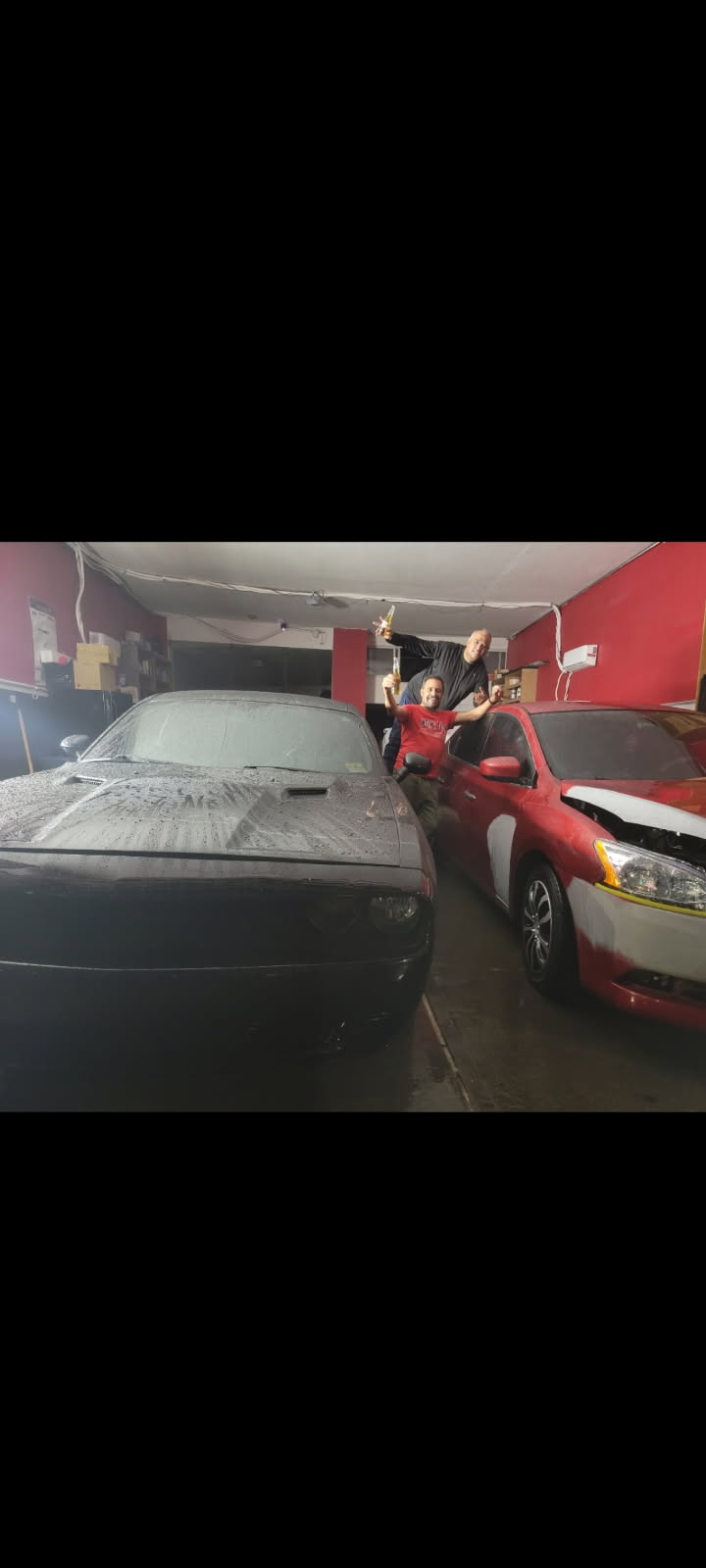 Classic vehicles receiving body and paint work inside the Brooklyn auto body shop