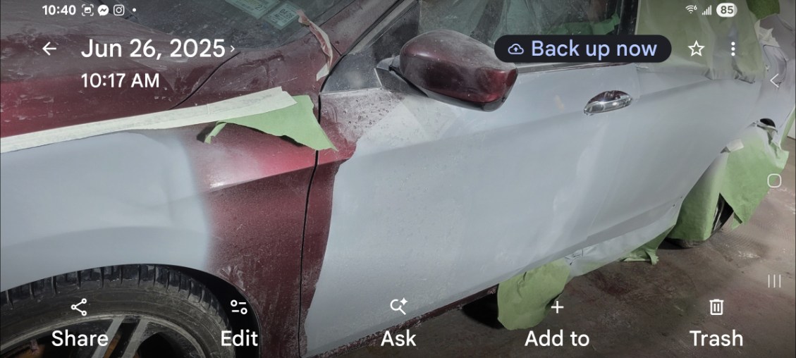 Vehicle doors and fender in primer during paint preparation